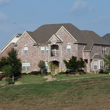 Exterior of brick home in Allen by Platinum Painting