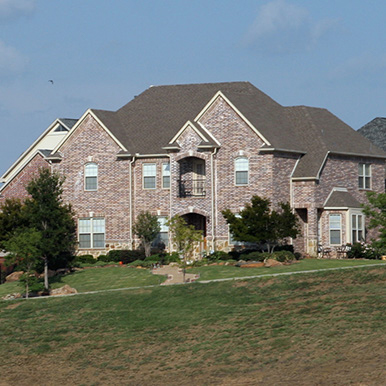 Exterior of brick home in Wiley by Platinum Painting