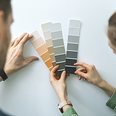 a person selecting a paint color for their commercial painting project
