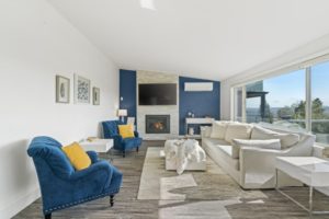 a living room with a blue accent wall