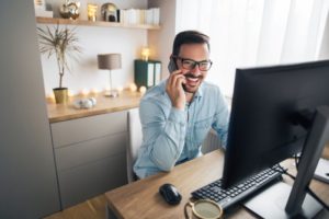 happy man working in his home office