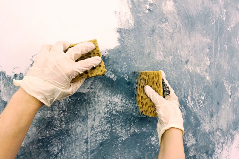 person creating sponge walls