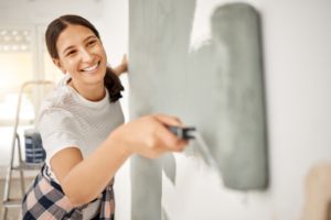 a person painting their home’s interior 